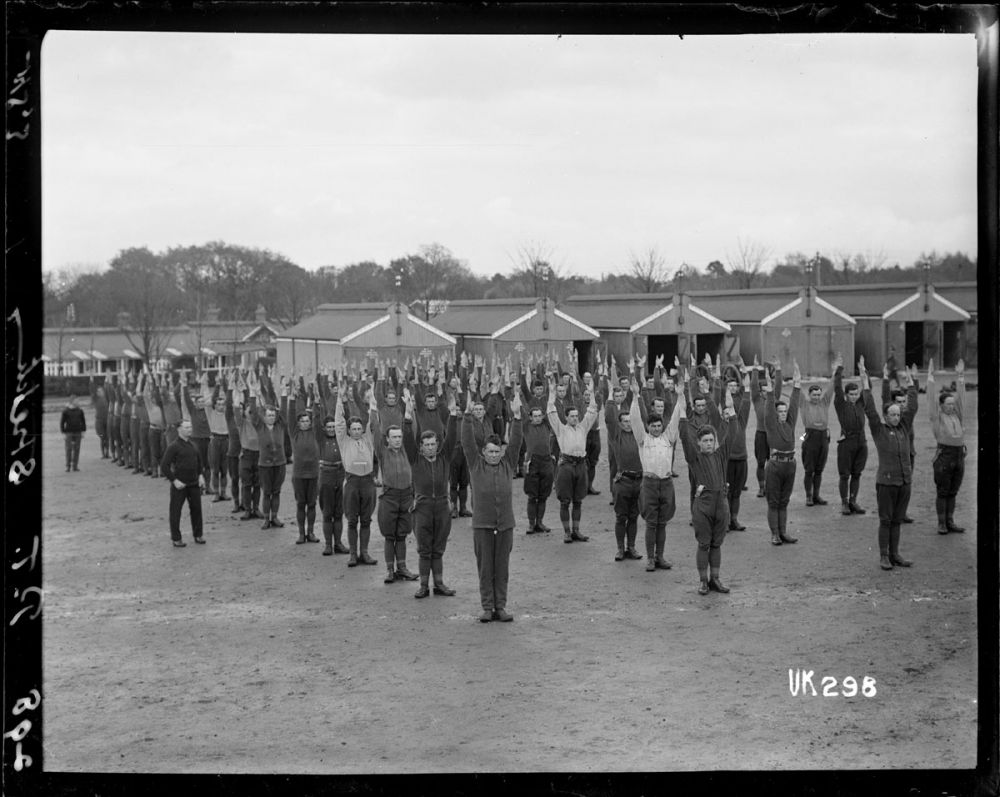 New Zealand Artillery soldiers perform physical training exercises at camp, Ewshot, England. 1918.